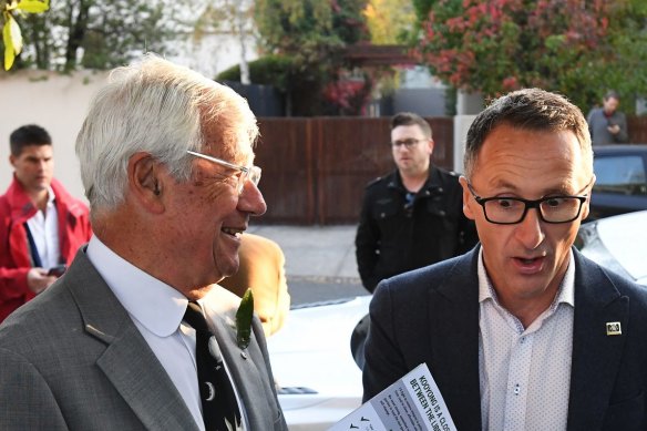  Julian Burnside (left) has put his hand up to replace Greens leader Richard Di Natale (right) in the senate.