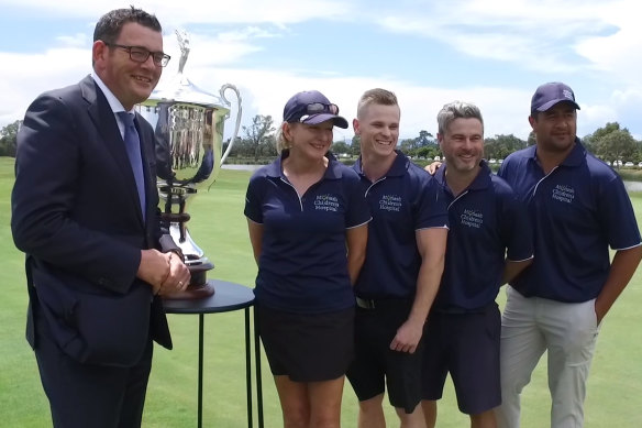 Daniel Andrews presents a trophy at a golf day in aid of the Monash Children's Hospital in November, 2017. 