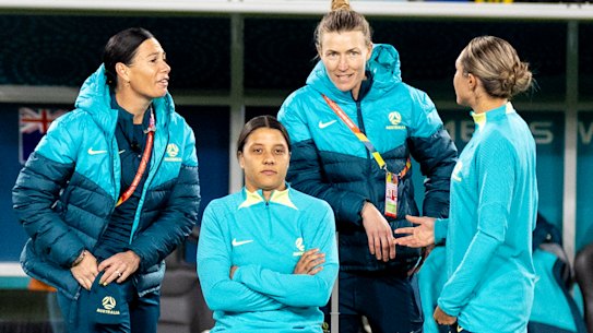 Sam Kerr sits on the sideline injured ahead of the Matildas clash with Ireland.