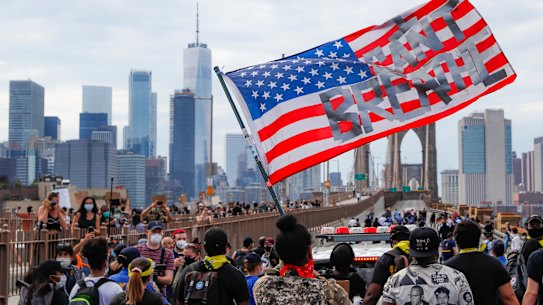 Protesters march on the Brooklyn Bridge in New York.