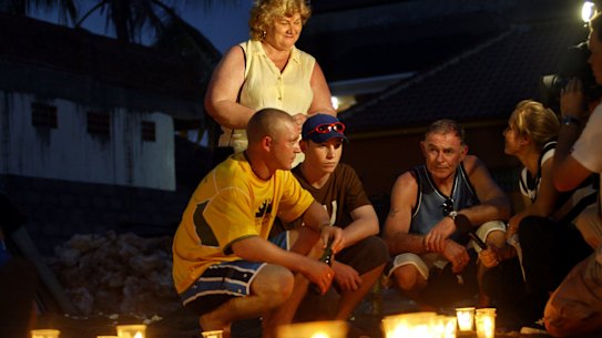 The Thompson family lays out candles at the sight of the Sari Club in 2012.