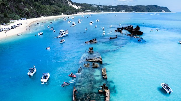 Tangalooma Beach, on Moreton Island, is slated for shark surveillance drones alongside about a dozen popular beaches earmarked by the Queensland government for drones, nets, and drumlines.