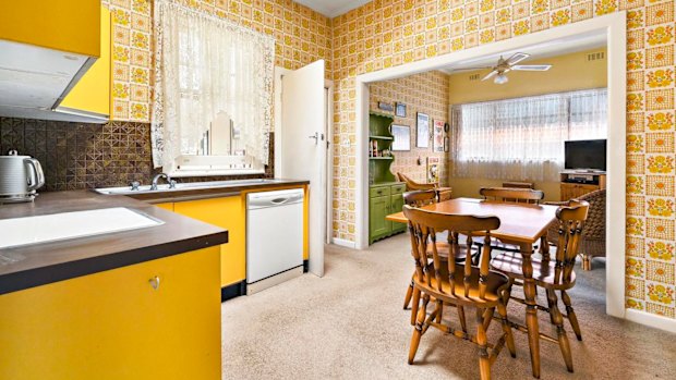 The bright yellow kitchen at 70 Cooper Street
