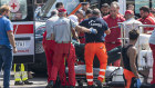 Rescuers recoup the body of one of those on board the luxury yacht when it sank.