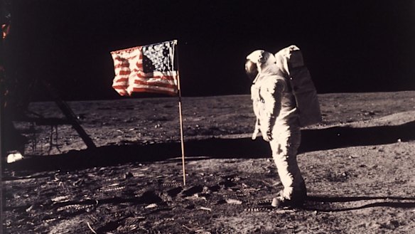 Time to return, says Pence. Astronaut  "Buzz" Aldrin poses for a photograph beside the US flag planted on the moon during the Apollo 11 mission on July 20, 1969. 