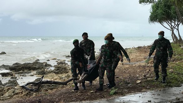 A corpse is retrieved from the beach at Tanjung Lesung beach resort.