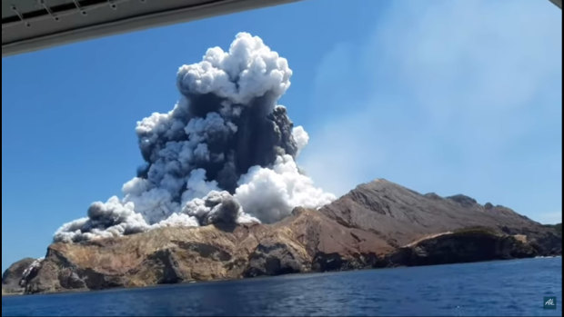 A screen grab of the White Island volcano eruption from a video taken by tourist Allessandro Kauffmann, who was then safely on a boat, in shock.