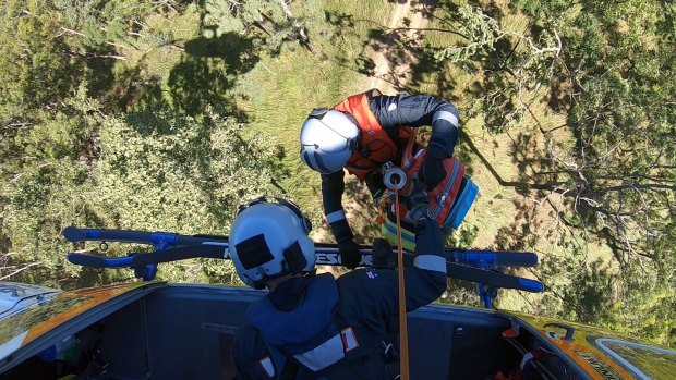 The injured woman, who was thrown off a quad bike and fell 50 metres, was winched out of Mia Mia State Forest on Monday.