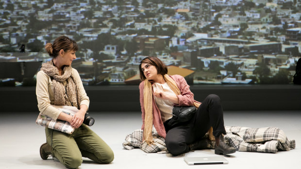 Suzie (Sheridan Harbridge), right, is visited in Kabul by an old journalist chum, Bec (Amber McMahon).