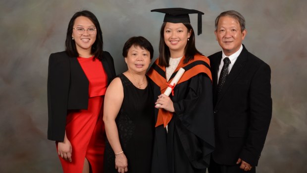 The Nguyen family. Fairfax reporter Han Nguyen, third left, with her sister Duyen, mum Chi and dad Sang at her graduation in May. 
