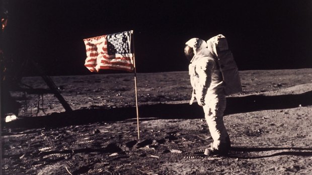Time to return, says Pence. Astronaut  "Buzz" Aldrin poses for a photograph beside the US flag planted on the moon during the Apollo 11 mission on July 20, 1969. 