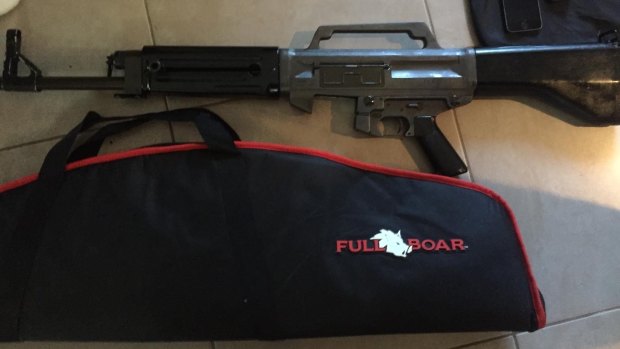 Firearms, ammunition and drug equipment were found on the Gold Coast.