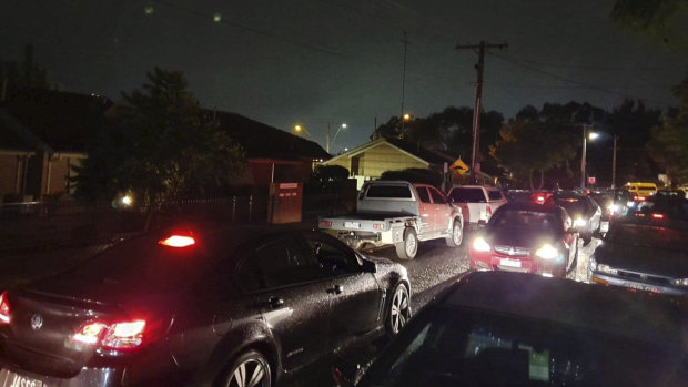 Revelers pour into Duncan Street following the Paradigm Festival at Flemington Racecourse on Saturday night. Locals say that no traffic management was in place and ride-share drivers lined up on either side of the street led to grid-lock and chaotic scenes.