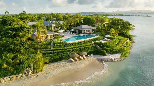 This beachfront home in Jumby Bay offers resort-style living.