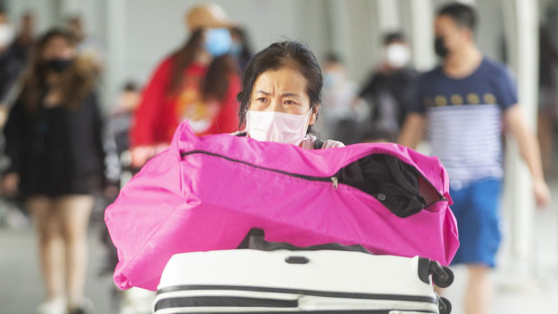 Passengers leaving the Sydney International Airport on Saturday. The coronavirus outbreak has gutted international travel demand. 