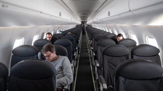 An almost empty British Airways plane flies from Milan to London.