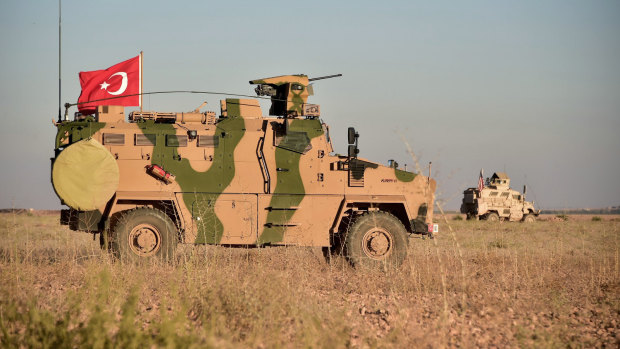 Turkish and US troops conduct joint patrols around the Syrian town of Manbij in November as part of an agreement that aimed to ease tensions between the two NATO allies.