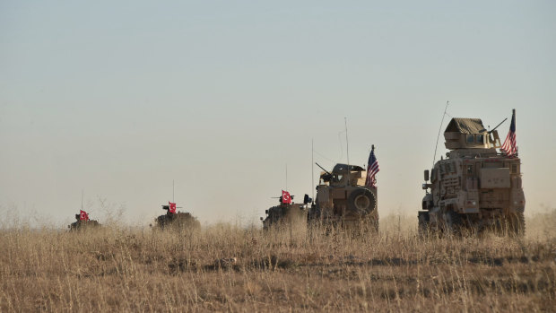 Turkish and US troops conduct joint patrols around the Syrian town of Manbij last month, as part of an agreement that aimed to ease tensions between the two NATO allies. 