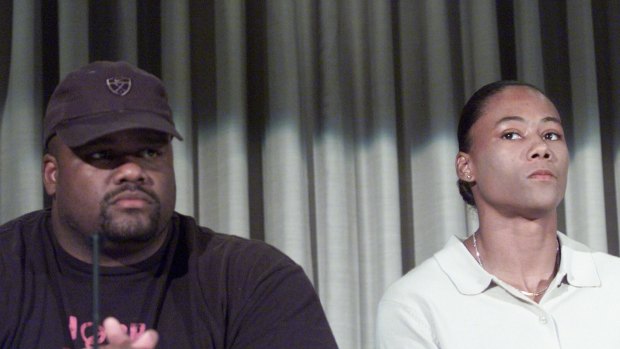 The American shot-putter CJ Hunter  with his sprint star wife Marion Jones at a press conference in Sydney.