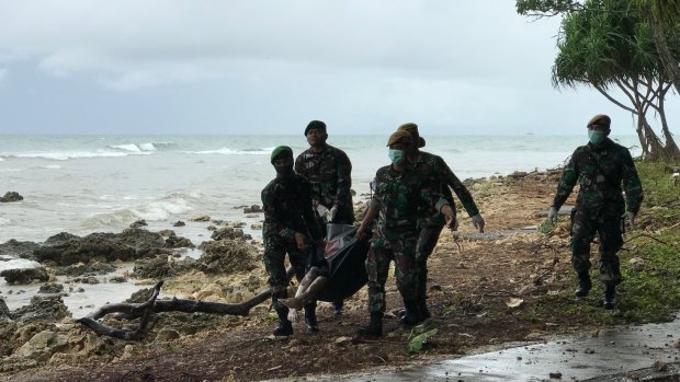 A corpse is retrieved from the beach at Tanjung Lesung beach resort.