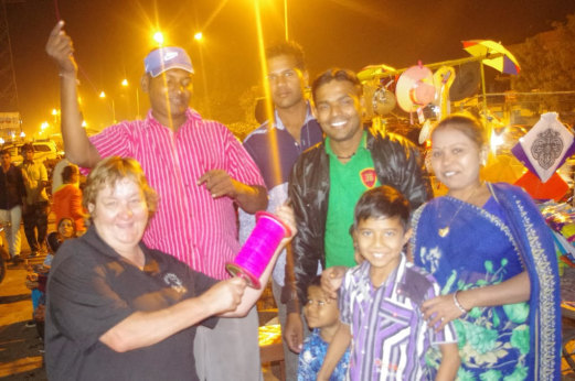 Jo Baker (lef) in 2016 in Gujarat, India, at a kite festival with locals.