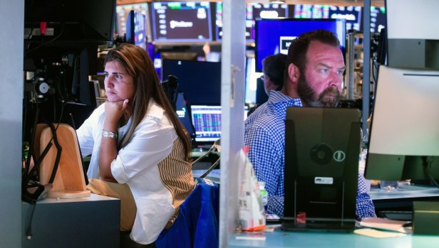 ASX slides as Wall Street’s momentum cools, but surge for Bitcoin