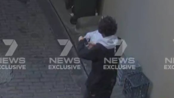 Mert Ney is captured via CCTV in the laneway near Clarence Street.