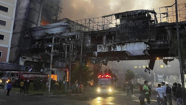 The fire burns through a Cambodian hotel casino near a Cambodia-Thai international border gate in Poipet, west of Phnom Penh.