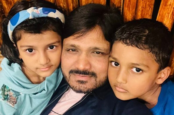 Rahemath Pasha, pictured with two of his three children, has been granted permanent residency in Australia. He said they were all excited to come to Australia.