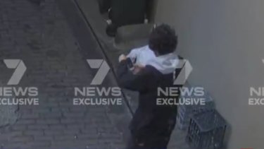 Mert Ney is captured via CCTV in the laneway near Clarence Street.