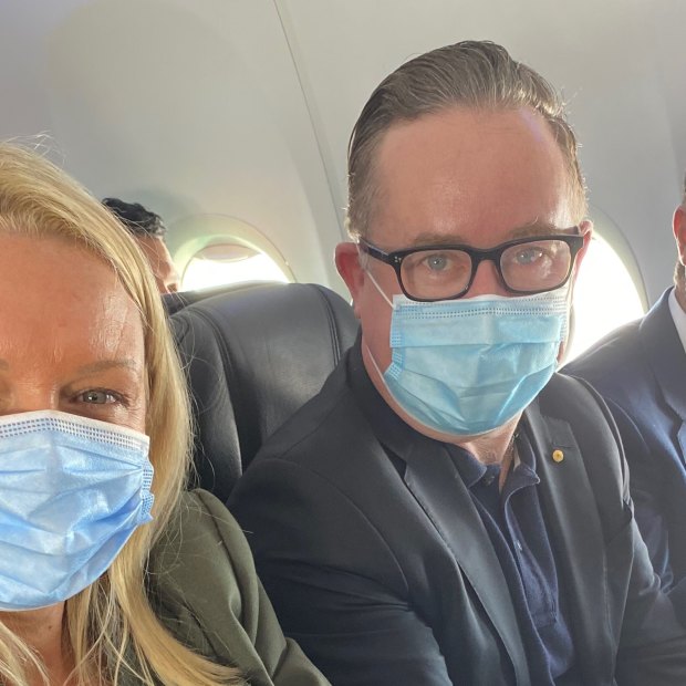 Happy with the middle seat in an early flight back in June: Qantas chief executive Alan Joyce, centre, with chief customer officer Steph Tully and Qantas International chief executive Tino La Spina.