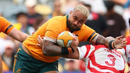 Lukhan Salakaia-Loto of the Wallabies is tackled by Shuhei Takeuchi of Japan.