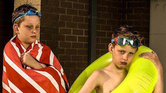 Vaughn (left) and Alexander Dawson's parents are struggling to afford swimming lessons.
