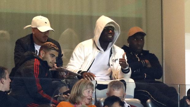 Thumbs up: Pogba in the stands during the League Cup loss to Derby.