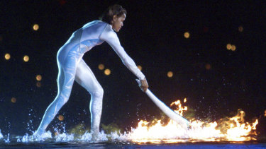 Cathy Freeman ignites the Olympic flame in 2000 ... and her words lit the fire for the Brisbane bid for 2032.