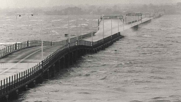 The old Hornibrook Bridge, which connected Clontarf Point to Brighton, amid heavy surf as Cyclone Dora bore down on Redcliffe in 1971.