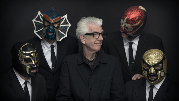 Nick Lowe with Los Straitjackets.