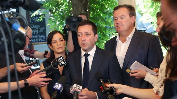 Then-Liberal leader Matthew Guy addressed the media with his wife Renae and Frankston candidate Michael Lamb (right) on November 19, 2018. 