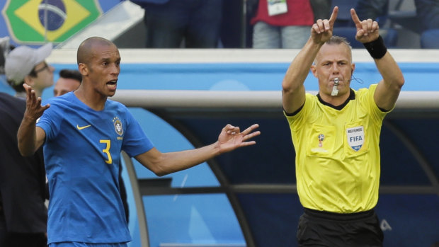 Big call: Brazil's Miranda reacts as Referee Bjorn Kuipers reverses his penalty decision.