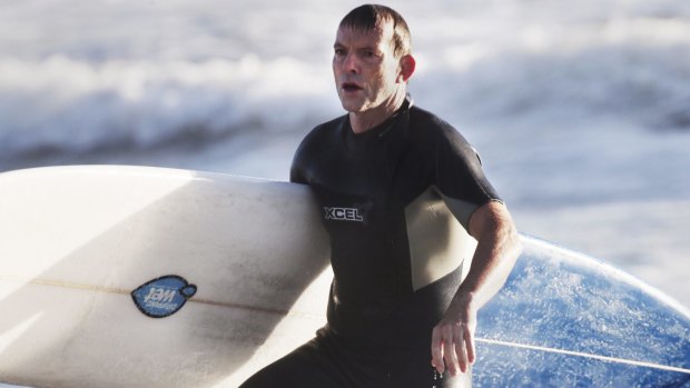 Tony Abbott, surfing in 2014.
