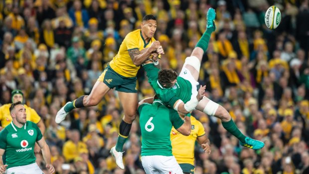 Wallabies fullback Israel Folau contests a kick-off, while Ireland's CJ Stander lifts captain Peter O'Mahony in the air.