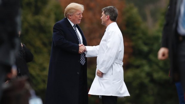 President Donald Trump, pictured meeting with physician Ronny Jackson, has preferred to pick staff who are familiar and loyal. 