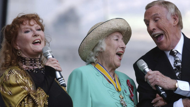 Dame Vera Lynn, centre,  singer Petula Clark, left and entertainer Bruce Forsyth sing "We'll Meet Again", during the World War II 60th Anniversary Service at Horse Guards Parade, in London, 2005. 