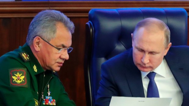 Russian President Vladimir Putin, right, and Defence Minister Sergei Shoigu in 2018.