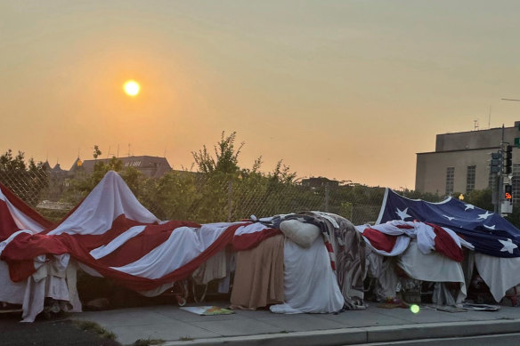 One of the encampments near Foggy Bottom in Washington is notable for the giant, American flag one man uses to protect his belongings.
