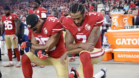 San Francisco 49ers safety Eric Reid (35) and quarterback Colin Kaepernick (7) kneel during the national anthem in 2016.