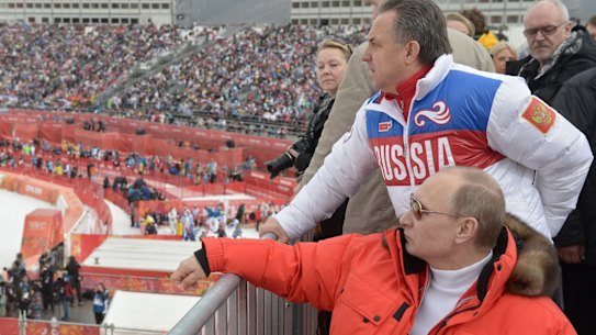 Russian president Vladimir Putin and sport minister Vitaly Mutko watch the 2014 winter Olympics in Sochi.