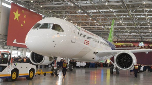 SHANGHAI, CHINA - NOVEMBER 02: (CHINA OUT) China's first self-developed large passenger jetliner C919 is presented after it rolled off the production line at Shanghai Aircraft Manufacturing Co., Ltd on November 2, 2015 in Shanghai, China. The C919 jet developed by Commercial Aircraft Corporation of China, Ltd. (COMAC) is scheduled to make its maiden flight in 2016.. (Photo by VCG/VCG via Getty Images) China's C919 airliner