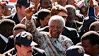 Nelson Mandela amid supporters in Soweto in 1999. “He wanted to be with the people, and rub shoulders,” says Barbara Masekela.