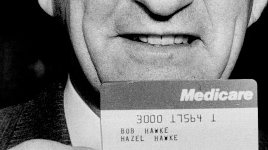 Bob Hawke with the first Medicare  card.